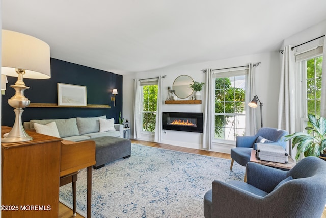 43 Sweet Gum Rd, Howell, NJ 07731 - living room with healthy amount of natural light, a glass covered fireplace, and wood finished floors