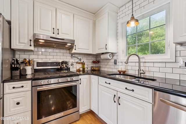 43 Sweet Gum Rd, Howell, NJ 07731 - kitchen featuring appliances with stainless steel finishes, under cabinet range hood, white cabinets, and backsplash