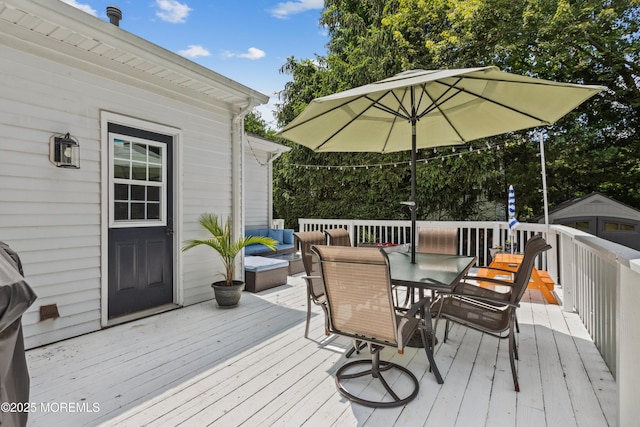 43 Sweet Gum Rd, Howell, NJ 07731 - deck with outdoor dining space and an outbuilding
