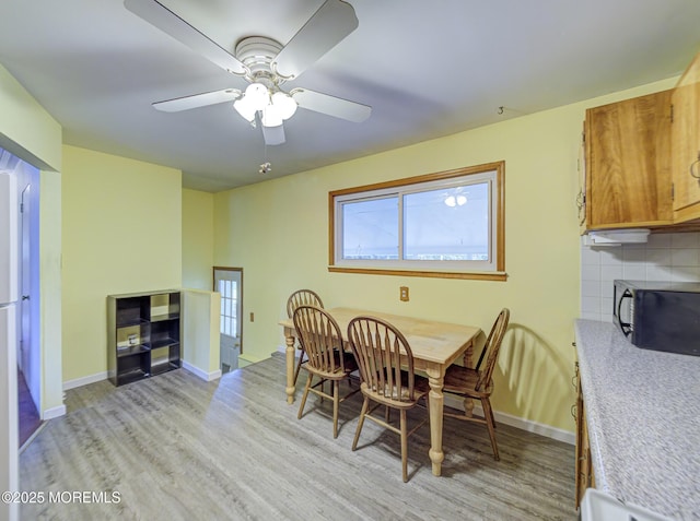 162 Attison Ave, Toms River, NJ 08757 - dining room with light wood finished floors and ceiling fan