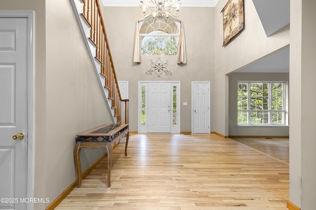 3 Canterbury Ct, Jackson, NJ 08527 - entrance foyer featuring a chandelier, light wood-style floors, stairway, ornamental molding, and a towering ceiling