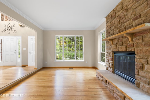 3 Canterbury Ct, Jackson, NJ 08527 - unfurnished living room featuring light wood-style floors, crown molding, and a stone fireplace