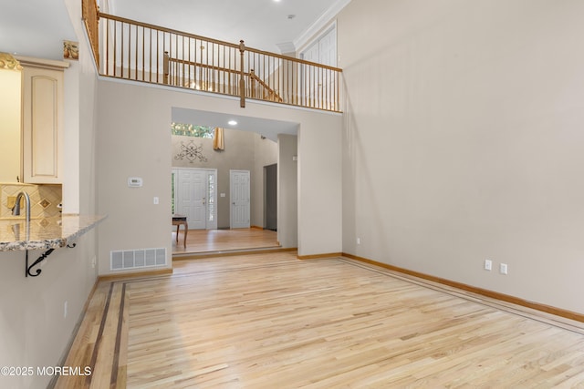 3 Canterbury Ct, Jackson, NJ 08527 - unfurnished living room with light wood-style flooring and a towering ceiling