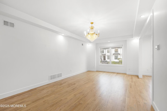 92 Wadsworth Ave, Lakewood, NJ 08701 - empty room featuring a chandelier, light wood finished floors, recessed lighting, and a tray ceiling