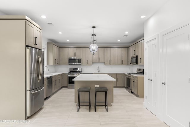 92 Wadsworth Ave, Lakewood, NJ 08701 - kitchen featuring stainless steel appliances, a center island, a breakfast bar, recessed lighting, and light countertops