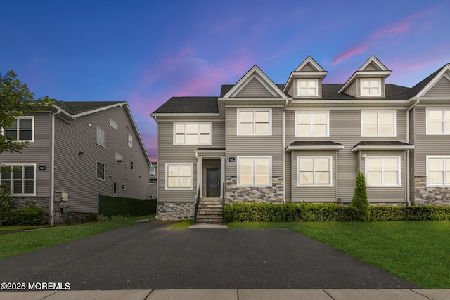 92 Wadsworth Ave, Lakewood, NJ 08701 - view of property featuring stone siding, a lawn, and entry steps