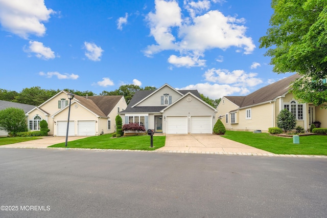 23 Dexter Ln, Jackson, NJ 08527 - traditional-style home featuring concrete driveway, a garage, and a front yard