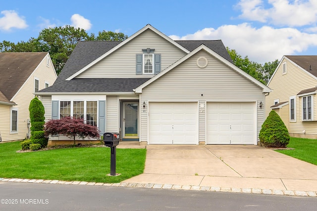 23 Dexter Ln, Jackson, NJ 08527 - traditional-style house featuring driveway, a garage, a front yard, and a shingled roof