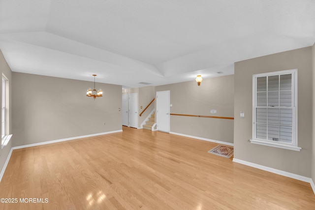 23 Dexter Ln, Jackson, NJ 08527 - empty room featuring a chandelier, stairs, and light wood-style floors