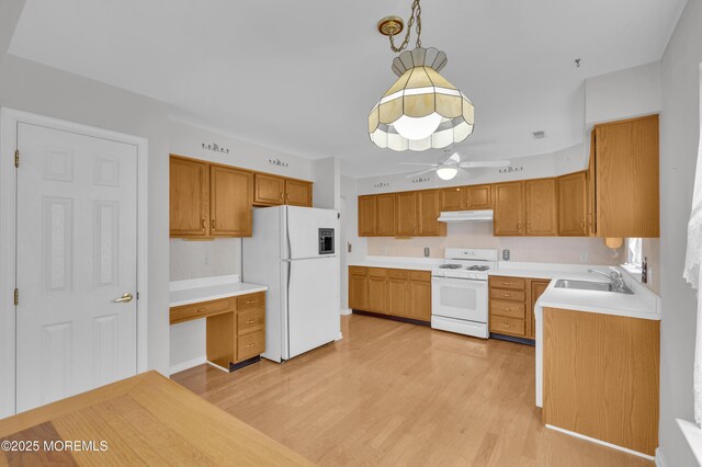 23 Dexter Ln, Jackson, NJ 08527 - kitchen with white appliances, under cabinet range hood, light wood-style floors, ceiling fan, and light countertops