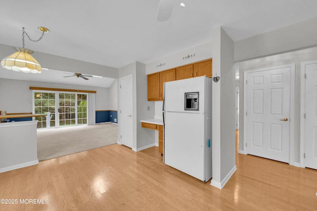 23 Dexter Ln, Jackson, NJ 08527 - kitchen with freestanding refrigerator, ceiling fan, light wood-style flooring, brown cabinets, and light countertops