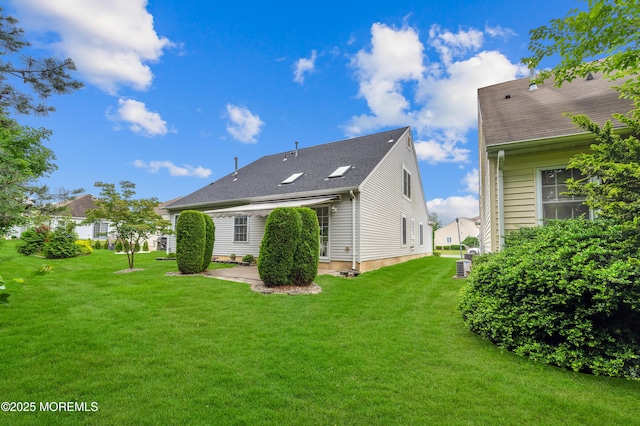 23 Dexter Ln, Jackson, NJ 08527 - rear view of property with a lawn and a patio area