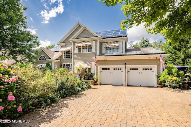 648 Point Ave, Brick, NJ 08724 - view of front of home with roof mounted solar panels and decorative driveway