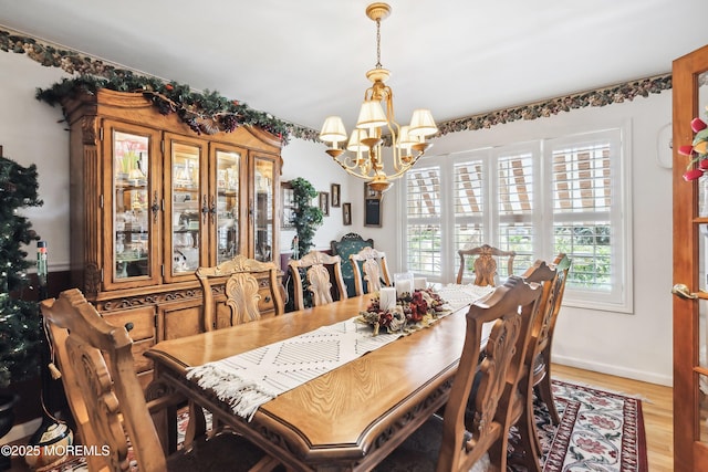 648 Point Ave, Brick, NJ 08724 - dining area with a chandelier and light wood-style floors