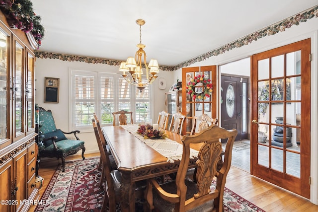 648 Point Ave, Brick, NJ 08724 - dining area with a chandelier and light wood finished floors