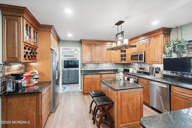 648 Point Ave, Brick, NJ 08724 - kitchen with appliances with stainless steel finishes, decorative backsplash, light wood-style flooring, and recessed lighting