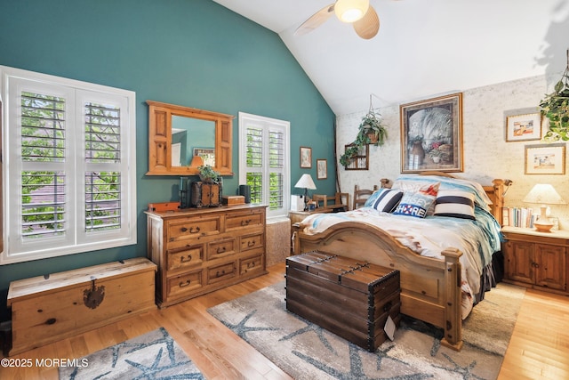 648 Point Ave, Brick, NJ 08724 - bedroom with an accent wall, light wood-style flooring, wallpapered walls, a ceiling fan, and high vaulted ceiling