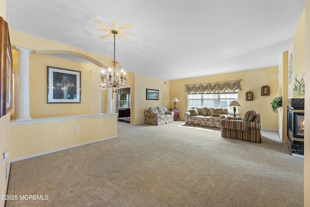 6 Boticelli Ct, Manchester, NJ 08759 - living room with carpet, a chandelier, and decorative columns