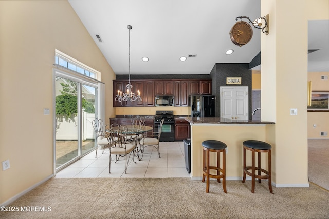 6 Boticelli Ct, Manchester, NJ 08759 - kitchen featuring black appliances, light colored carpet, dark countertops, a chandelier, and high vaulted ceiling
