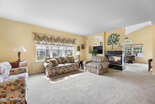 6 Boticelli Ct, Manchester, NJ 08759 - living area with carpet flooring, plenty of natural light, a multi sided fireplace, and arched walkways