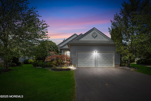 6 Boticelli Ct, Manchester, NJ 08759 - view of front facade featuring asphalt driveway, a lawn, and an attached garage