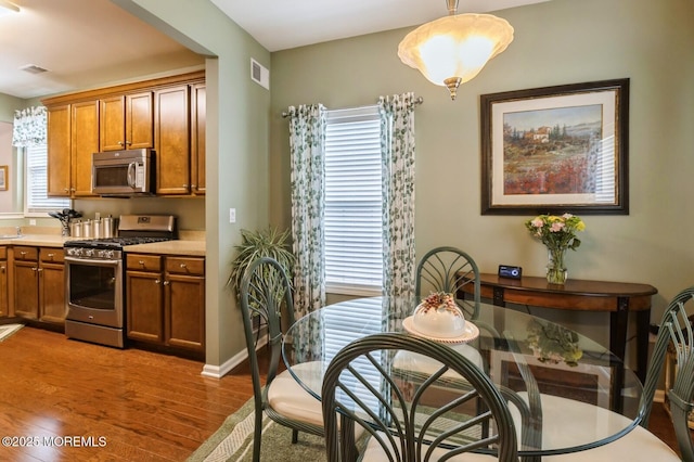 10 Inkberry Ln, Howell, NJ 07731 - dining area with wood finished floors and plenty of natural light