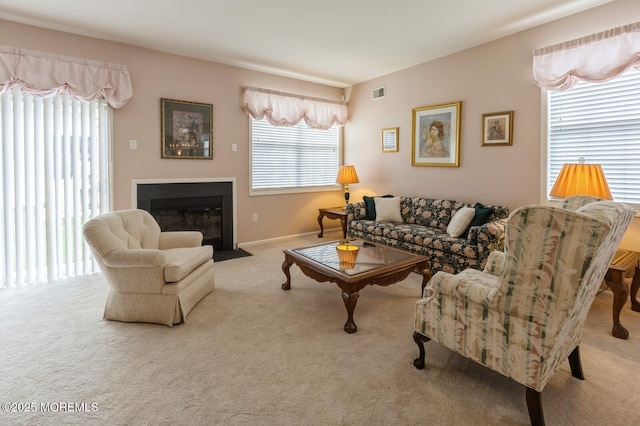 10 Inkberry Ln, Howell, NJ 07731 - carpeted living area featuring plenty of natural light and a fireplace with flush hearth