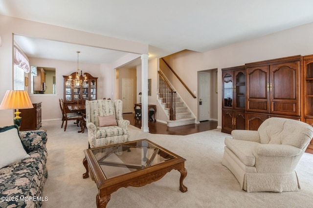 10 Inkberry Ln, Howell, NJ 07731 - living room with a chandelier, light carpet, stairway, and ornate columns