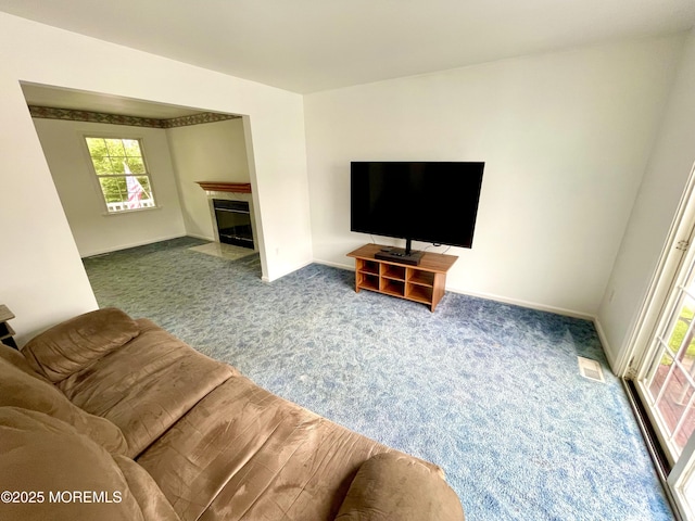 229 Stern Ave, Manahawkin, NJ 08050 - living room featuring carpet floors, healthy amount of natural light, and a fireplace with flush hearth