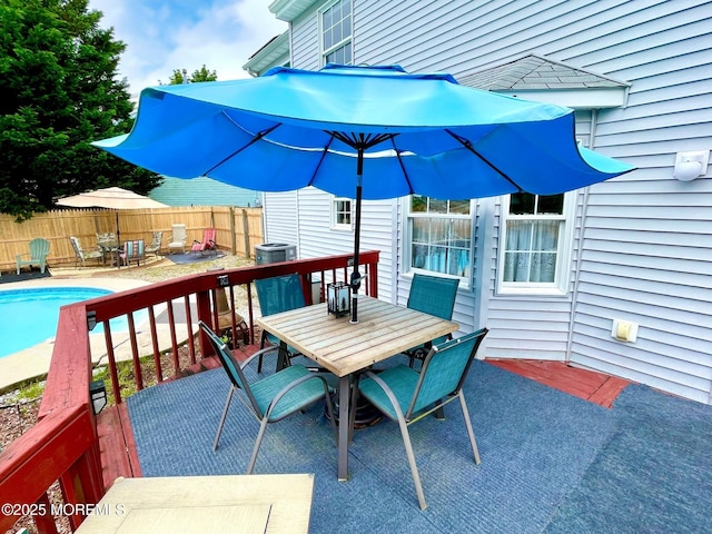 229 Stern Ave, Manahawkin, NJ 08050 - wooden terrace featuring outdoor dining area, a fenced backyard, and a patio area