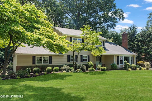 4 Hamilton Hill Rd, Lincroft, NJ 07738 - view of front of home with a chimney and a front lawn