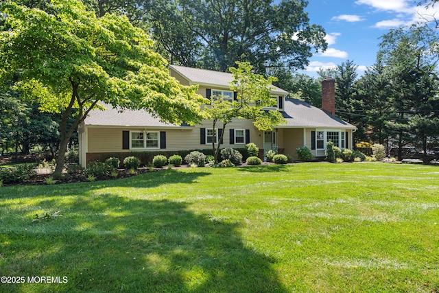 4 Hamilton Hill Rd, Lincroft, NJ 07738 - view of front facade featuring a chimney and a front lawn