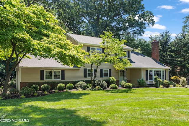 4 Hamilton Hill Rd, Lincroft, NJ 07738 - view of front facade with a chimney and a front lawn