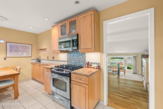 4 Hamilton Hill Rd, Lincroft, NJ 07738 - kitchen featuring stainless steel appliances, light countertops, glass insert cabinets, recessed lighting, and backsplash
