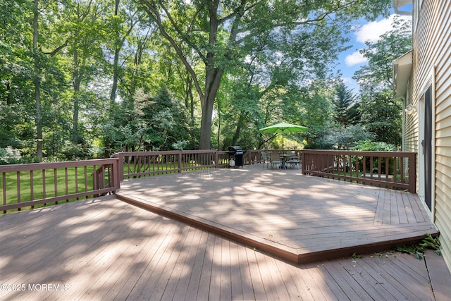 4 Hamilton Hill Rd, Lincroft, NJ 07738 - wooden terrace with area for grilling, outdoor dining area, and view of scattered trees
