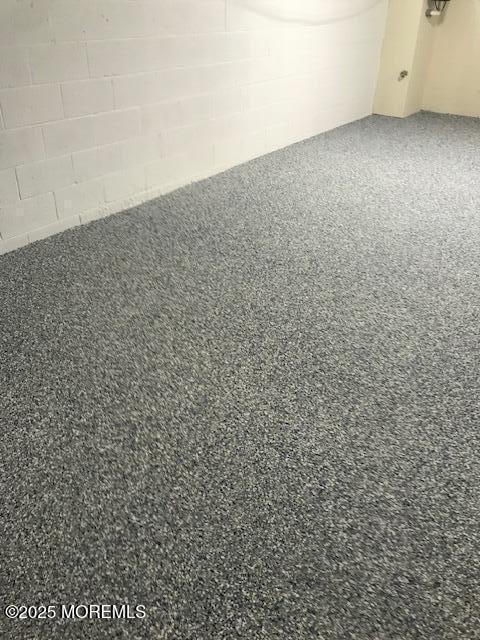 119 Dupont Ave Unit 2A, Seaside Heights, NJ 08751 - detailed view of speckle patterned floor and concrete block wall
