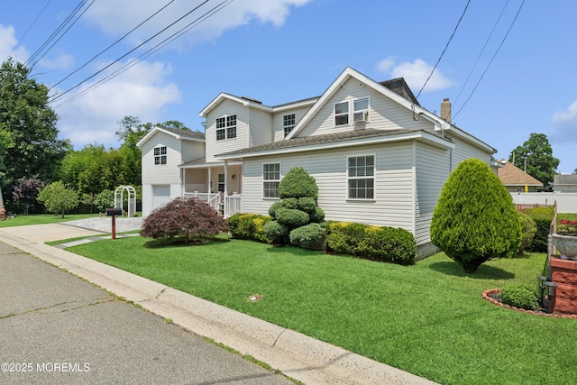 413 Sullivan Pl, Union Beach, NJ 07735 - traditional home featuring a front yard, driveway, an attached garage, a chimney, and a shingled roof