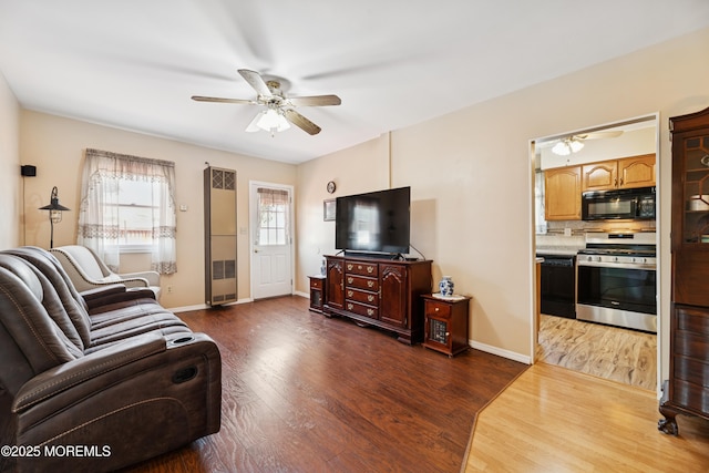 413 Sullivan Pl, Union Beach, NJ 07735 - living room with ceiling fan and dark wood-style flooring