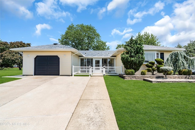 13 Canaries Ct, Toms River, NJ 08757 - single story home with concrete driveway, an attached garage, and a shingled roof