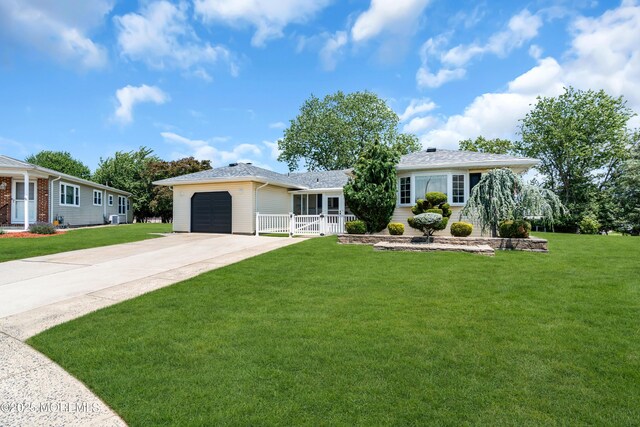 13 Canaries Ct, Toms River, NJ 08757 - single story home with driveway, a front lawn, and an attached garage