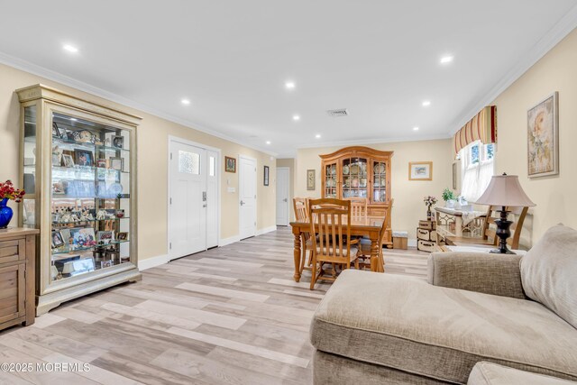 13 Canaries Ct, Toms River, NJ 08757 - living area featuring healthy amount of natural light, crown molding, light wood finished floors, and recessed lighting