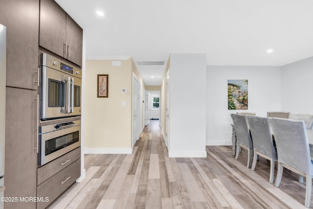 13 Canaries Ct, Toms River, NJ 08757 - kitchen with light wood-style flooring, double oven, dark brown cabinetry, and recessed lighting