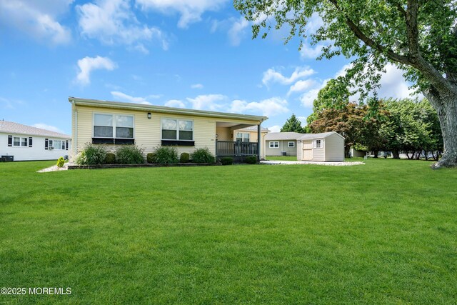 13 Canaries Ct, Toms River, NJ 08757 - back of house featuring a yard and an outdoor structure