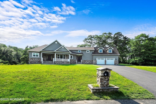 7 Rodeo Ct, Howell, NJ 07731 - craftsman inspired home with stone siding, covered porch, a front yard, asphalt driveway, and an attached garage