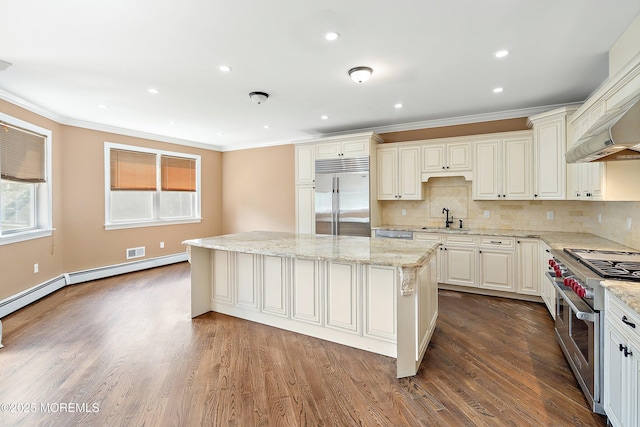 7 Rodeo Ct, Howell, NJ 07731 - kitchen featuring premium appliances, ornamental molding, a kitchen island, light stone countertops, and tasteful backsplash