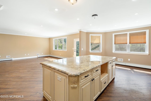 7 Rodeo Ct, Howell, NJ 07731 - kitchen with cream cabinets, crown molding, baseboard heating, dark wood-style floors, and light stone countertops