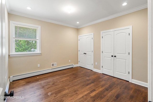 7 Rodeo Ct, Howell, NJ 07731 - unfurnished bedroom with a baseboard radiator, multiple closets, dark wood-type flooring, crown molding, and recessed lighting