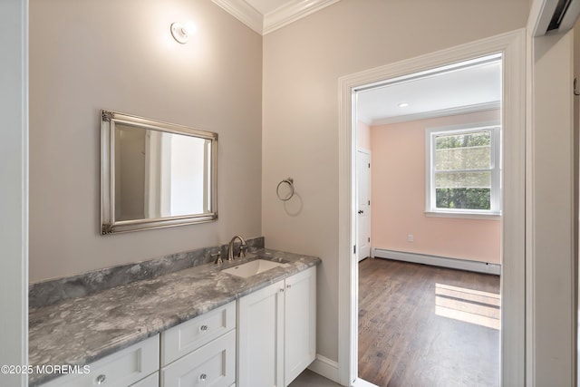 7 Rodeo Ct, Howell, NJ 07731 - bathroom with a baseboard radiator, crown molding, vanity, and wood finished floors