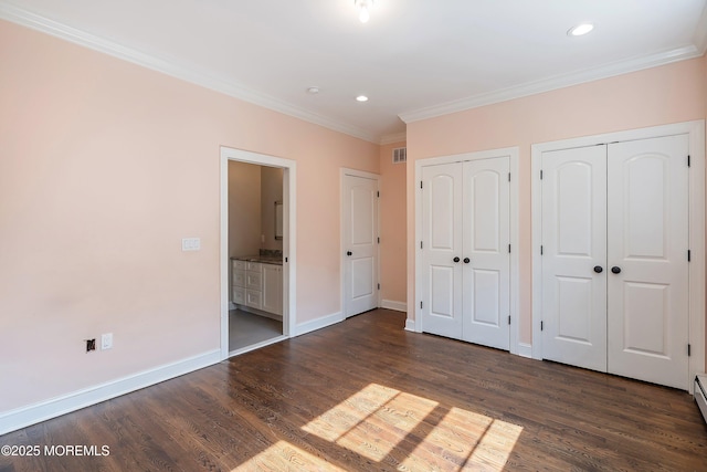 7 Rodeo Ct, Howell, NJ 07731 - unfurnished bedroom featuring multiple closets, crown molding, dark wood-style flooring, recessed lighting, and connected bathroom