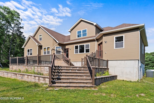 7 Rodeo Ct, Howell, NJ 07731 - back of property with a yard, roof with shingles, and a wooden deck